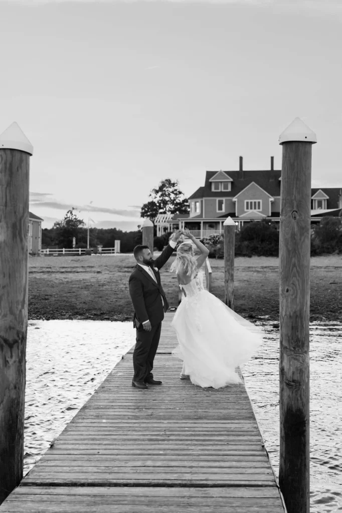 Newly married couple spinning on the dock at the Shining Tides