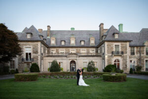 Couple kissing in the front garden of Aldrich Mansion in Rhode Island.